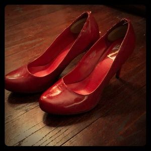 Red patent pumps